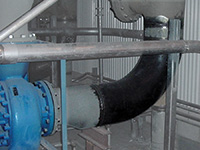 crowded factory section with vortab vel installed at pump